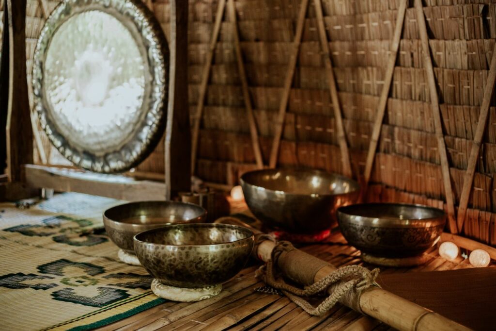 Tibetan singing bowls and gong for meditation and sound healing rituals.