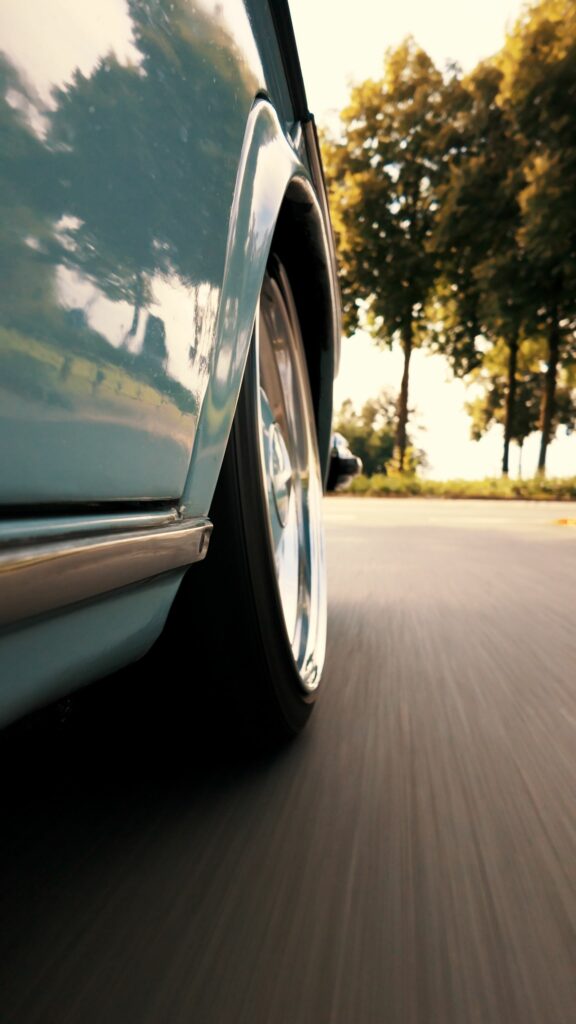 Capture of a vintage car speeding on a road in Deutschland, classic and retro feel.